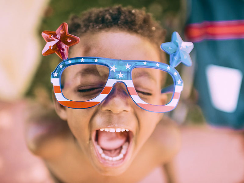 Child Wearing USA Flag Branded Glasses Child Wearing USA Flag Branded Glasses
